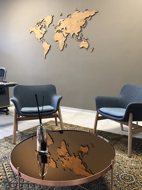 Wooden wall map of world in travel office